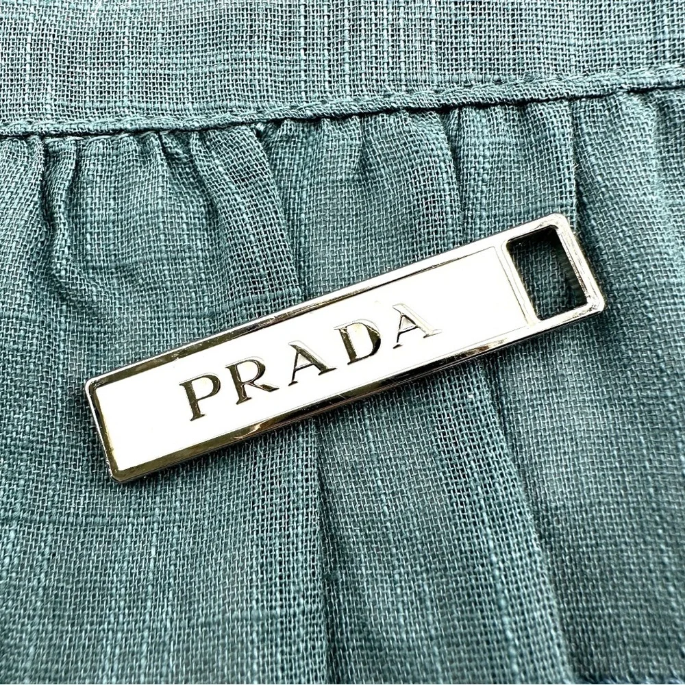 Prada charm w/bonus gift. AUTHENTIC White and silver.